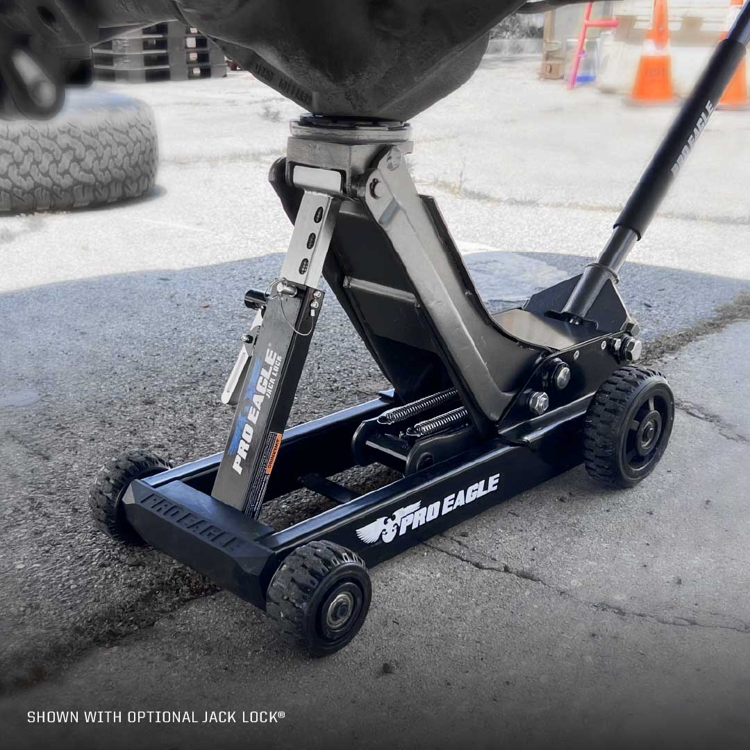 Black Pro Eagle 3 Ton off-road shop jack labeled "Abrams" on an asphalt surface.