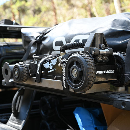 Black 27" anti rattle strap on a Pro Eagle off-road jack mounted on a truck bed.