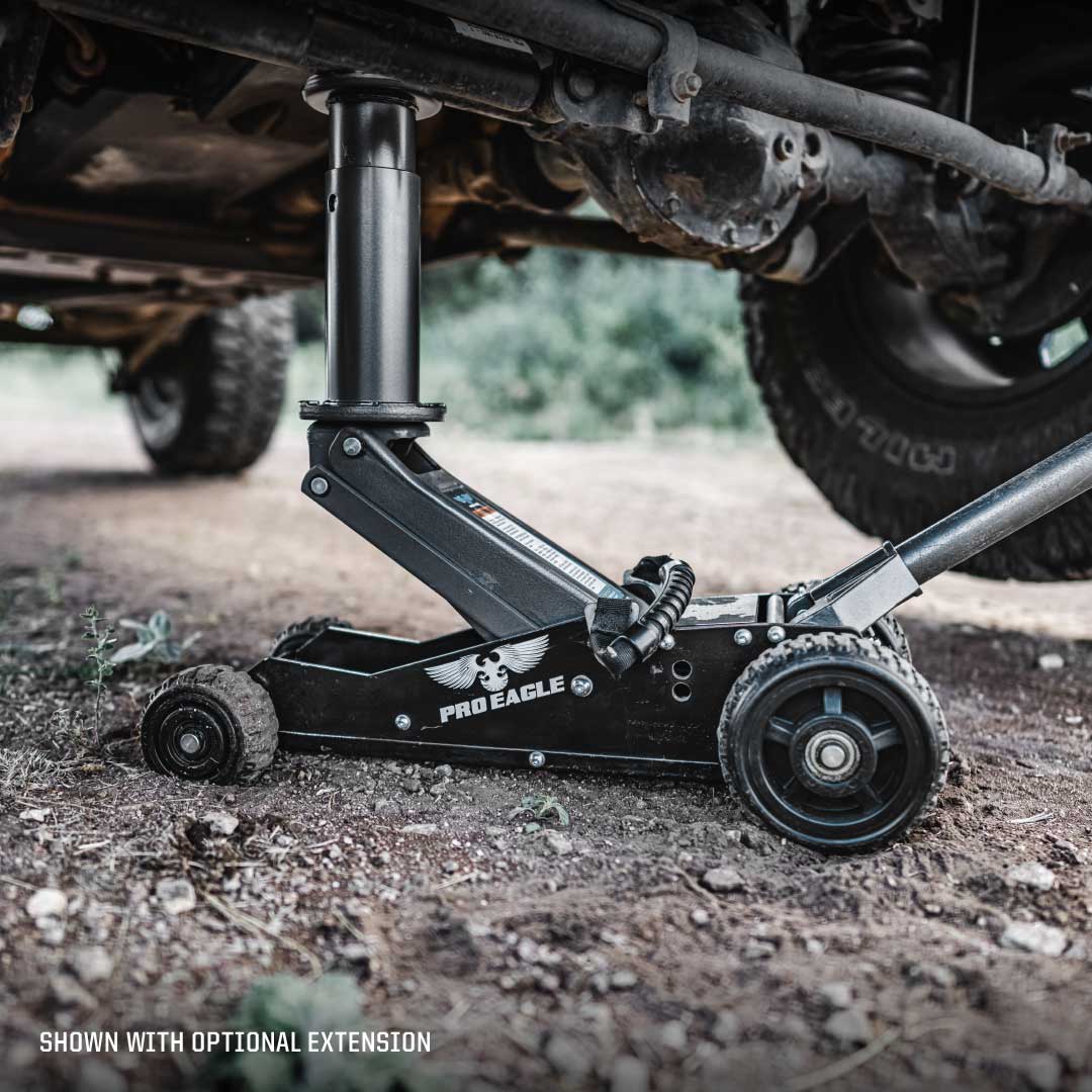 Black Pro Eagle off-road jack with big wheels under a vehicle, labeled "shown with optional extension"